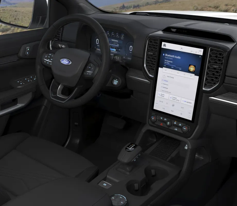 Lugar do condutor com ênfase no volante e no dashboard