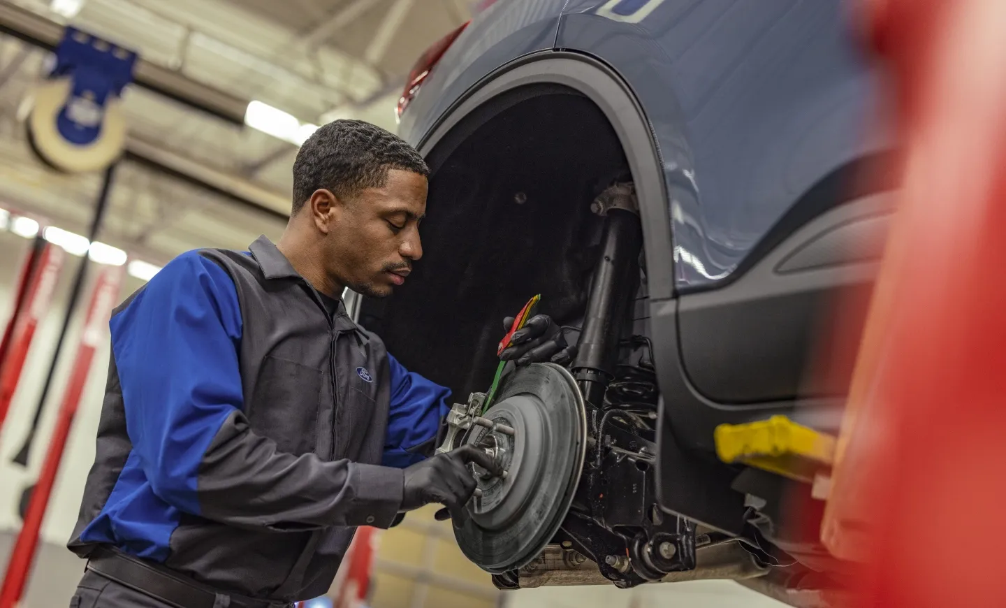 Mechanic checking the condition of a car's brakes