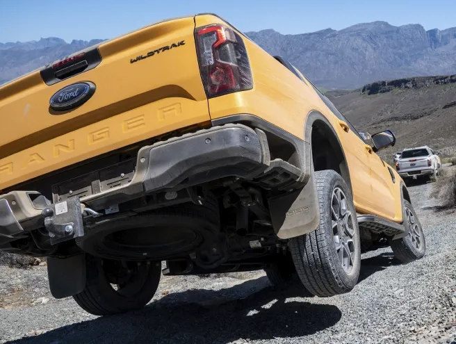 Ford Ranger on a steep descent with the right rear wheel in the air