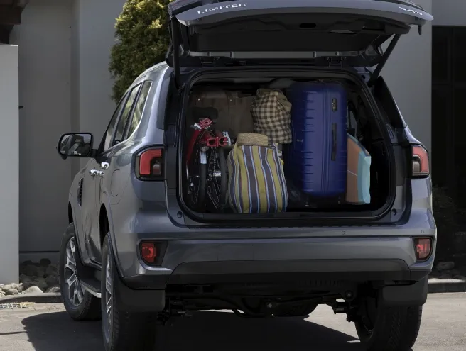 Ford Everest parked with the trunk open and full