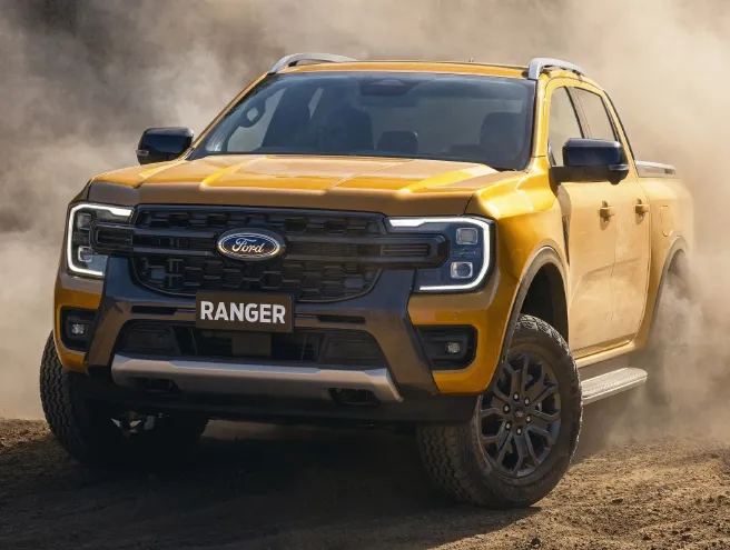 Ford Ranger on a hilly road and making a lot of dust