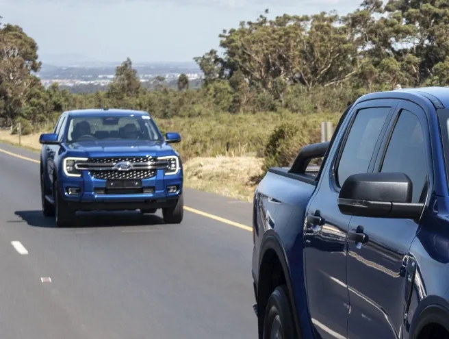 Ford Ranger driving along a savannah road