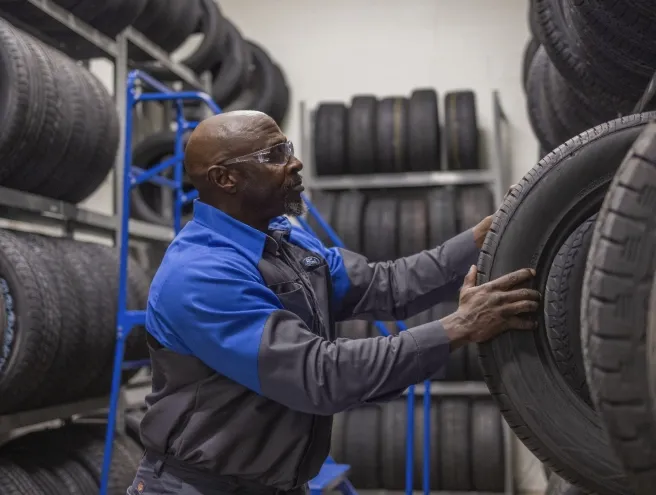 Technician choosing a tire