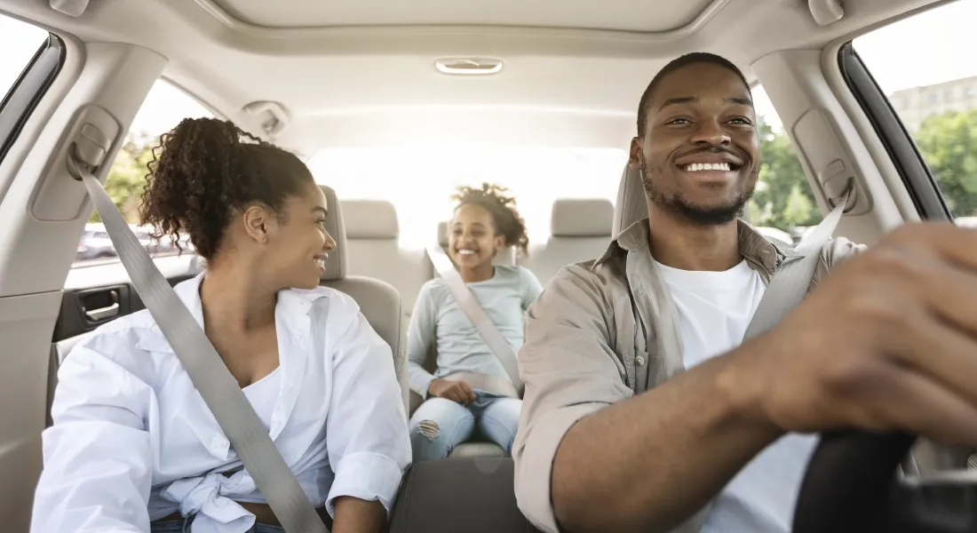 Family riding happily in their ford