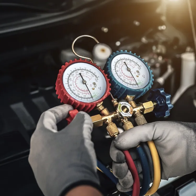 Mechanic doing a routine test on a car engine